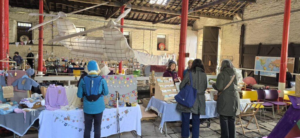 Shoppers browsing stalls inside the Transhipment Warehouse at the FAB Market.